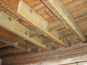 Bow ties installed through flow joists for lateral restraint