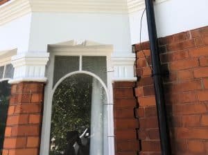 Vertical crack between bay window and front elevation of house