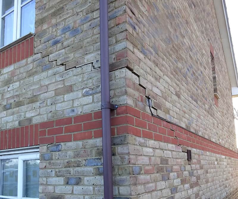 Stepped crack in brickwork around corner